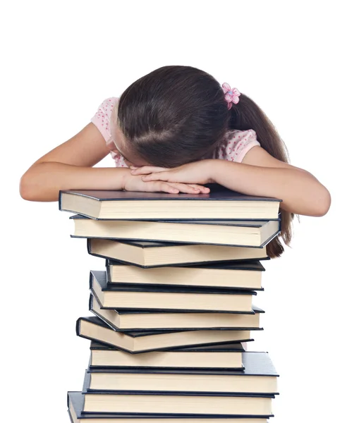 Девочка спит на книгах — стоковое фото