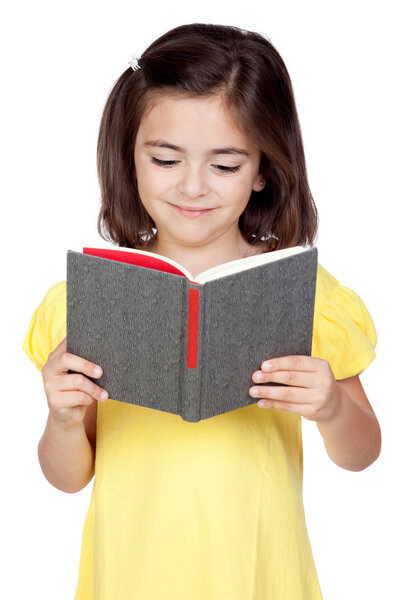 Brunette little girl reading a book