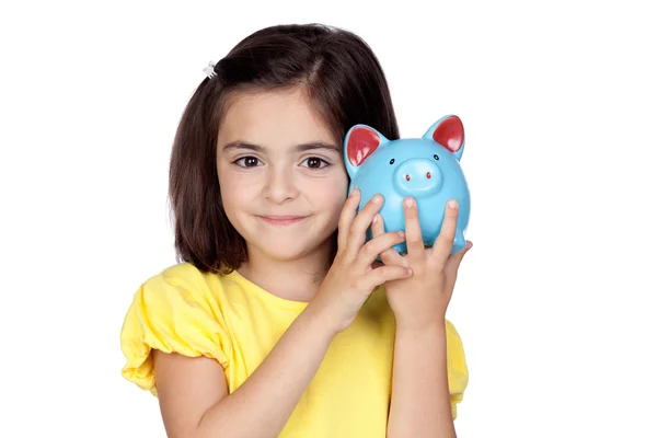 Bruna bambina con un moneybox blu — Foto Stock
