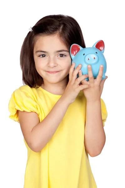 Brunette little girl with a blue moneybox — Stock Photo, Image