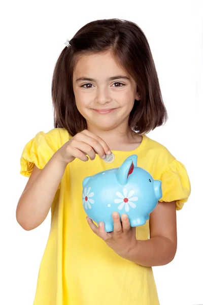 Brünettes kleines Mädchen mit blauer Spardose — Stockfoto