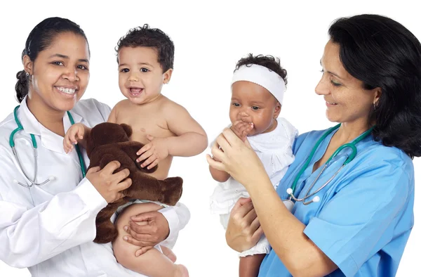 Two pediatricians with beautiful babies Stock Image