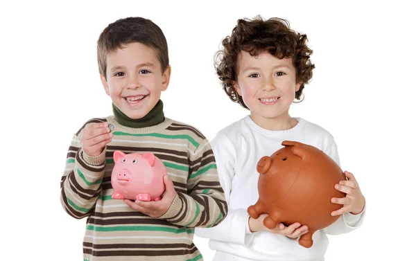 Two happy children with moneybox savings Royalty Free Stock Photos