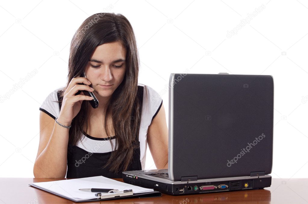 Teenager with phone and laptop studing