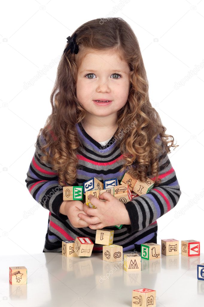 Adorable baby playing with wooden blocks