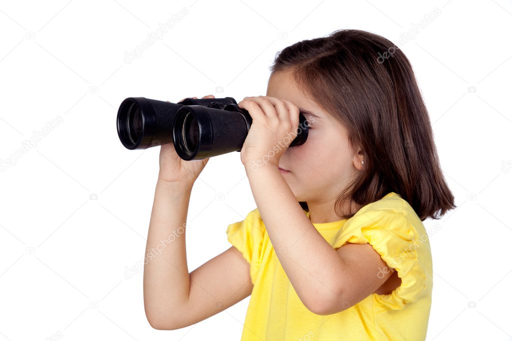 Brunette little girl looking through binoculars