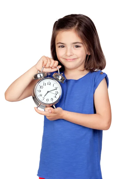 Brunette little girl with a silvered alarm-clock — Stock Photo, Image