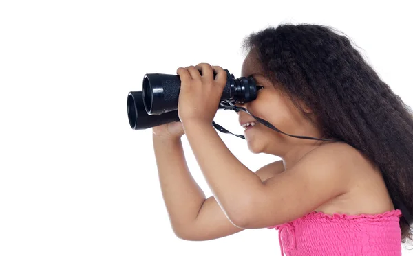 Girl looking through the binoculars — Stock Photo, Image