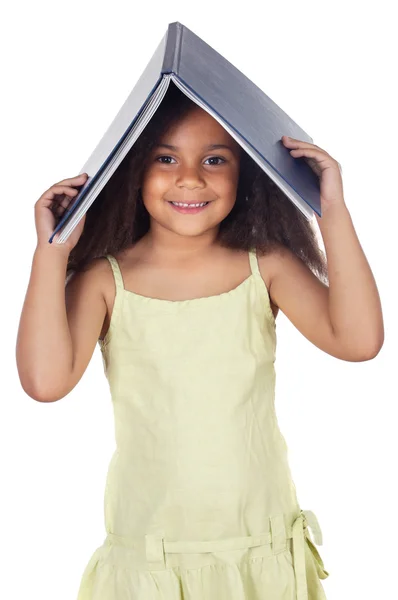 Girl holding book on head — Stock Photo, Image