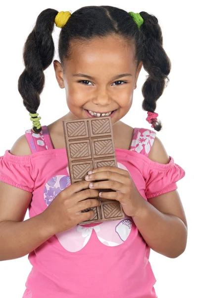 Çikolata yiyen sevimli kız. — Stok fotoğraf