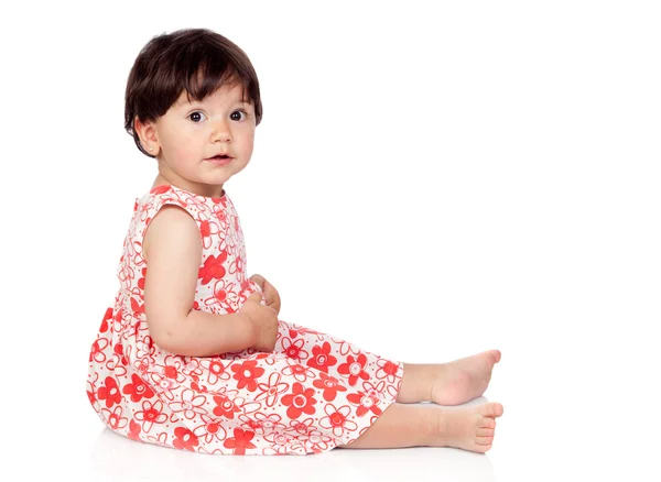 Schattige babymeisje met bloemen jurk — Stockfoto
