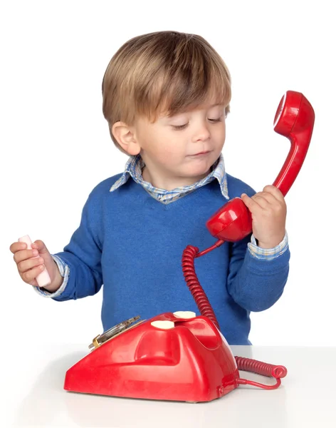Όμορφο μωρό με ένα κόκκινο τηλέφωνο — Φωτογραφία Αρχείου