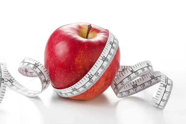Яблуко і вимірювальна стрічка — стокове фото