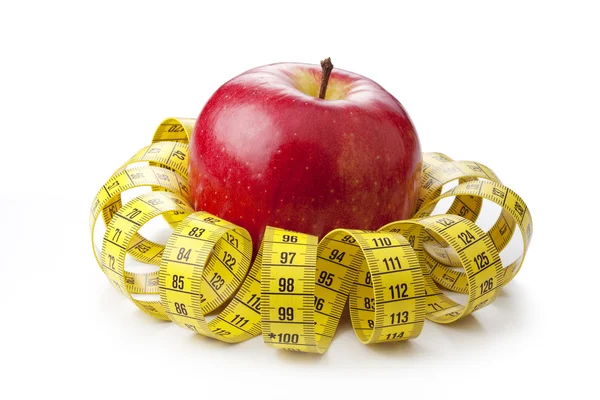 Apple and measuring tape — Stock Photo, Image