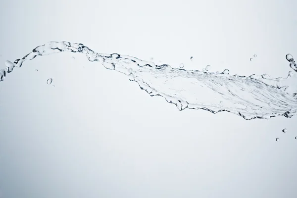 Vatten stänk på vit bakgrund Stockfoto