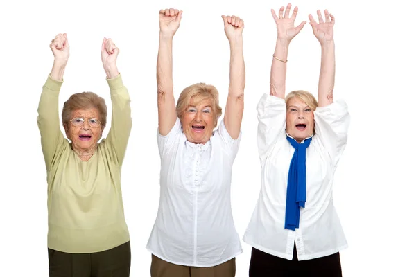 Три пожилые женщины поднимают руки . — стоковое фото