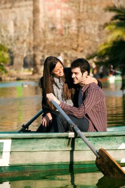 Happy couple on small boat. clipart