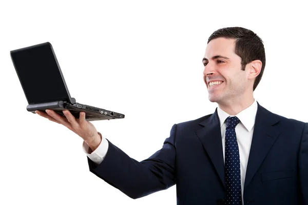 Confident business man holding laptop up high — Stock Photo, Image