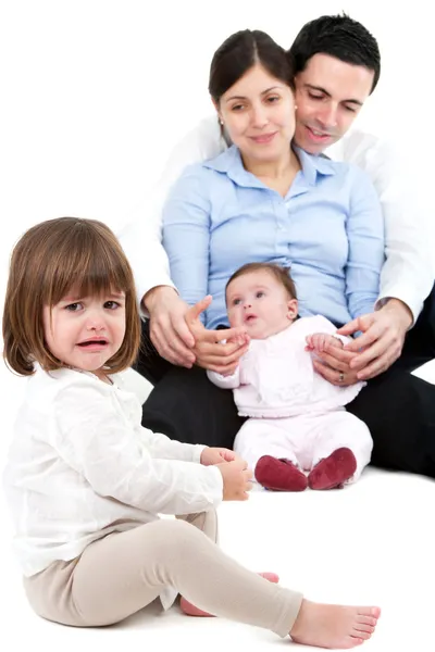 Niña celosa infeliz con familia —  Fotos de Stock