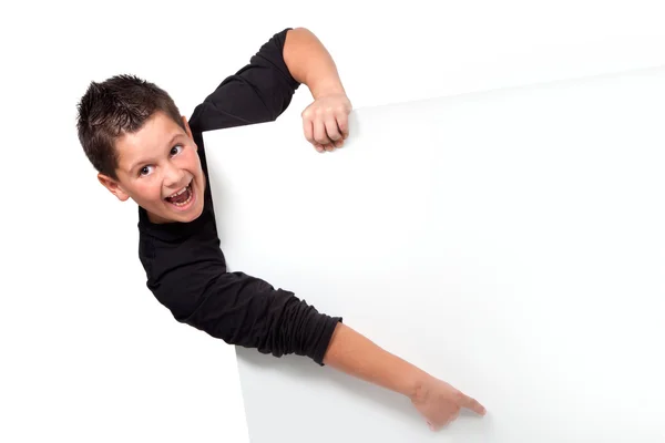 Portret van tiener jongen wijzende vinger op copyspace — Stockfoto
