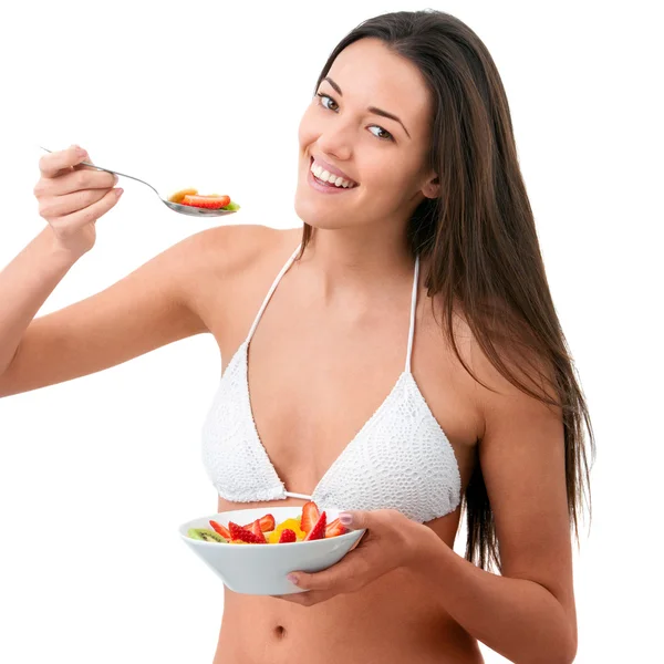 Young woman eating fruit. — Stock Photo, Image