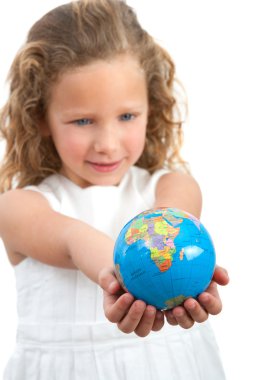 Young girl looking at earth sphere. clipart