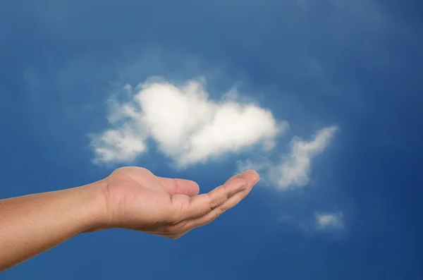 stock image Human open hand with white cloud on blue sky