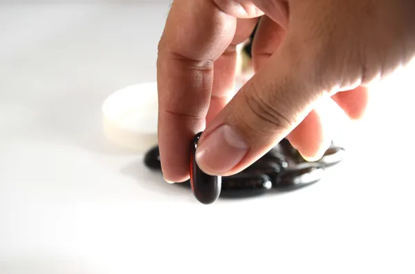 stock image Oil is extracted from seaweed deep in hand