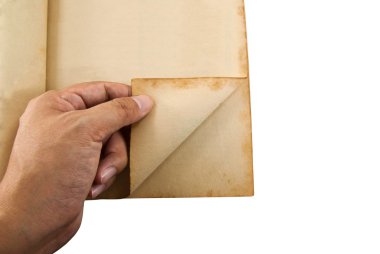 Man hand opening an old book with clipping path clipart