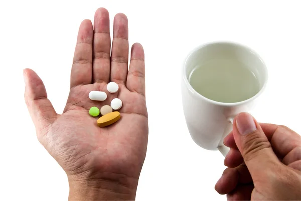 Tabletten und Wasser in den Händen isoliert auf weiß — Stockfoto