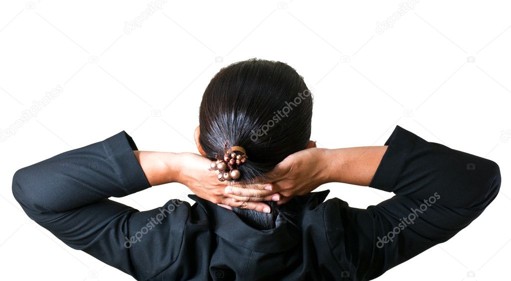 Close up of relaxed business woman from behind with open hands behind her head