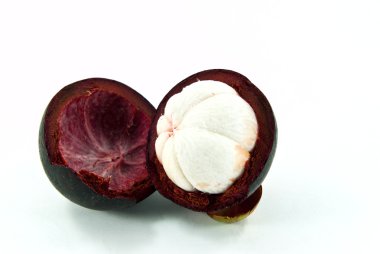 Mangosteen fruit and cross section showing white flesh of the queen of fruits. clipart