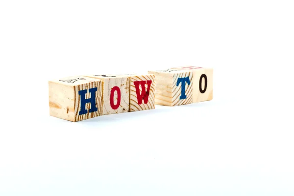 HOW TO word from wood alphabet blocks — Stock Photo, Image