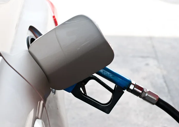 A car at gas station being filled with fuel — Stock Photo, Image