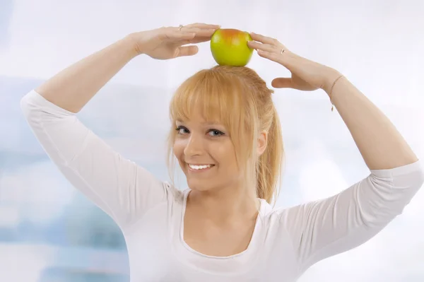 Closeup portrait of a happy woman with apple — Stock Photo, Image