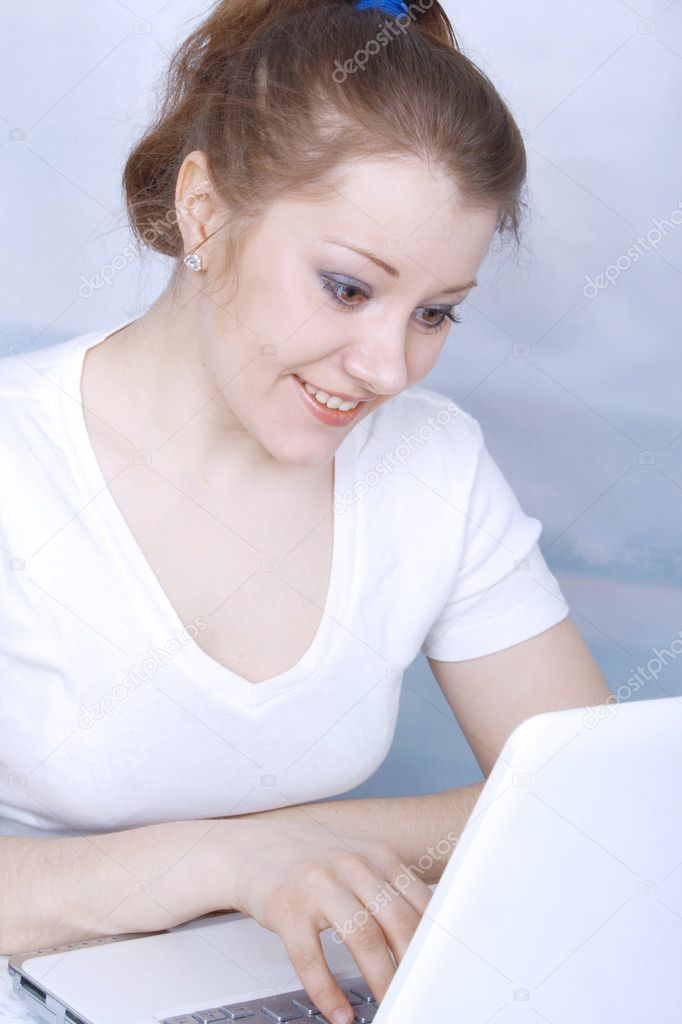 Portrait of smiling beautiful young asian woman with a notebook