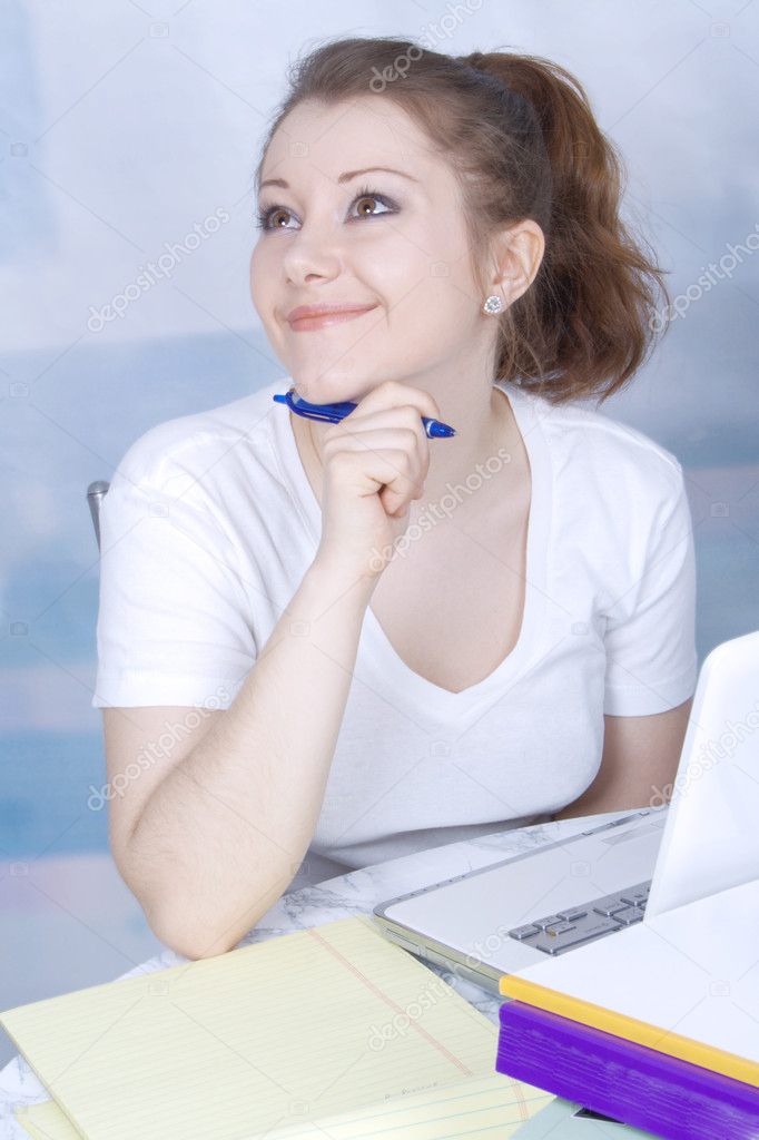 Portrait of a happy young asian woman with a laptop