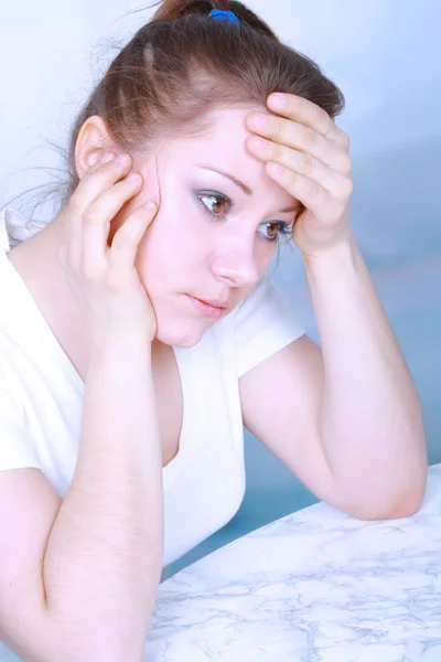 Portrait of a young asian woman suffering from a headache — Stock Photo, Image