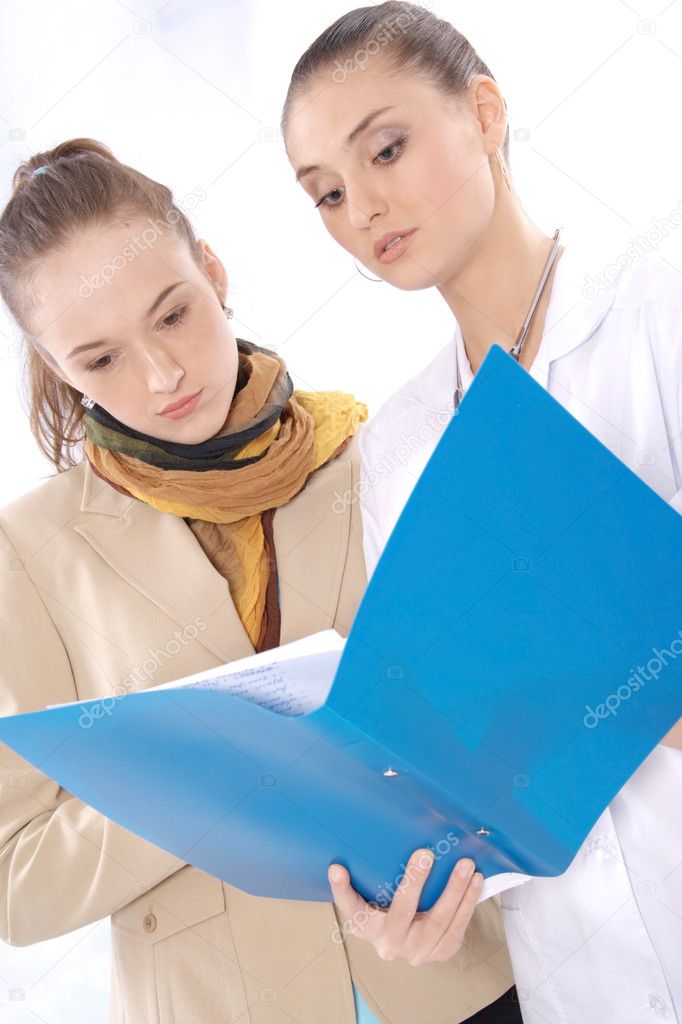 Female medical doctor and her patient discuss the results of tests