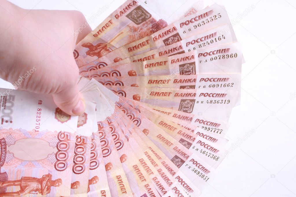 A hand with Russian banknotes