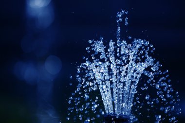 Water drops on dark blue background clipart