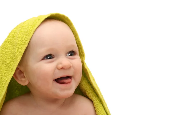 Smiling baby wrapped in a green towel (white background) — Stock Photo, Image