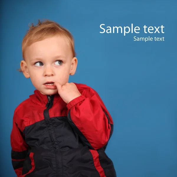 Cute little girl looking at sample text and thinking — Stock Photo, Image