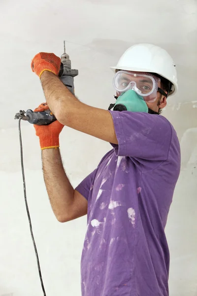 Handyman holding drill — Stock Photo, Image