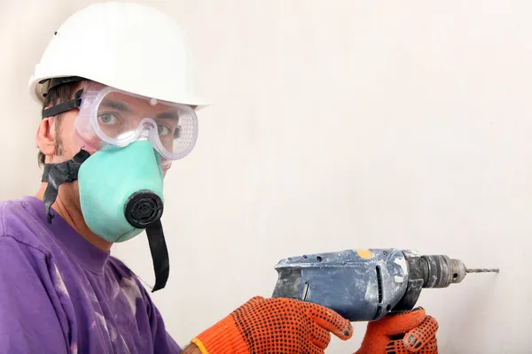 Worker holding drill — Stock Photo, Image