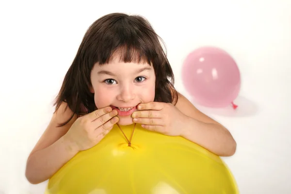 Little girl and two balloons — Stock Photo, Image
