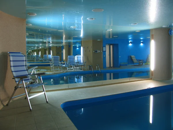 Indoor swimming pool with big mirror — Stock Photo, Image