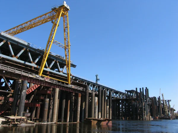 stock image Over river bridge construction site