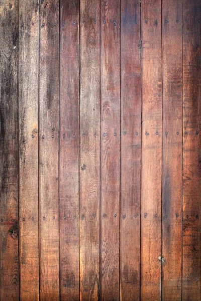 Old grungy wooden door with nails — Stock Photo, Image