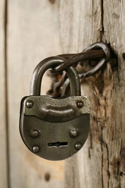 Vintage padlock on an old door — Stock Photo, Image